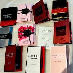 11 Designer purse/sample size perfumes.